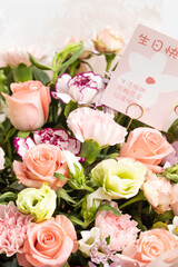 Beautiful flowers with birthday cards in them