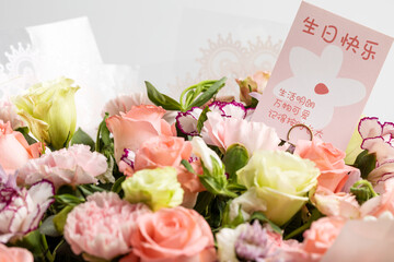 Beautiful flowers with birthday cards in them