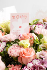 Beautiful flowers with birthday cards in them