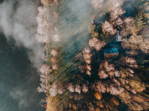 Autumn scene of lake and abandoned cottage in forest. Svitavy, Czech republic