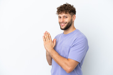 Young handsome caucasian man isolated on white background scheming something