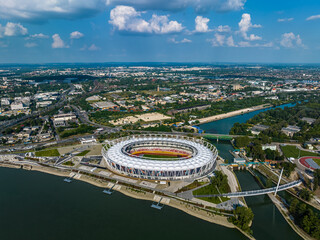 Budapest, Hungary - Aerial view of Budapest Skyline at summertime with National Athletics Centre sport arena and east riverbank of the capital of Hungary with blue sky and clouds