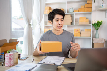 Business Owner Live Streaming Online Sales and Performing Sales with a Laptop, Packaging and Shipping Products from Home, Freelancing, Efficient Delivery and Packaging for Online Sales Business
