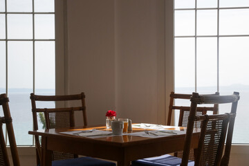 Empty seats and tables before dinner time in the indoor restaurant