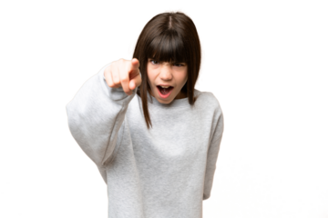 Little girl over isolated green chroma key background frustrated and pointing to the front