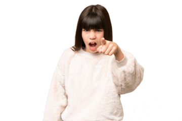 Little girl over isolated green chroma key background frustrated and pointing to the front