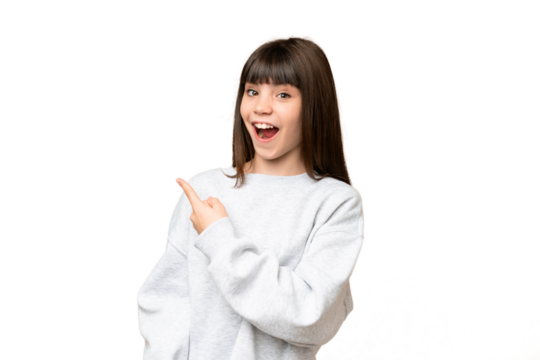Little girl over isolated green chroma key background surprised and pointing side - Powered by Adobe