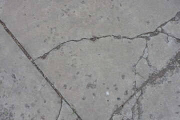 Obraz premium Background - light grey concrete slab with numerous cracks