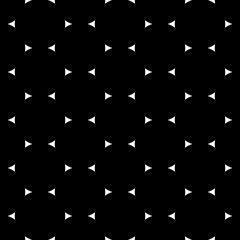 Seamless surface pattern design with jagged triangles. Triangular blocks wallpaper. Repeated white geometrical figures on black background. Ethnic mosaic motif. Digital paper with polygons ornament.