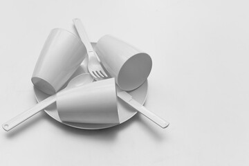 Black and white plastic cups plates forks for camping