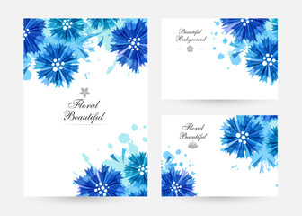 Romantic background with blue cornflowers and paint splashes.