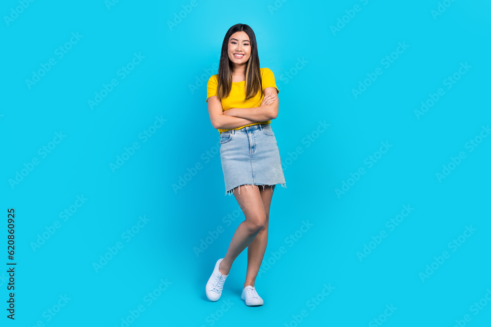 Sticker Full length photo of gorgeous positive person folded hands posing isolated on blue color background