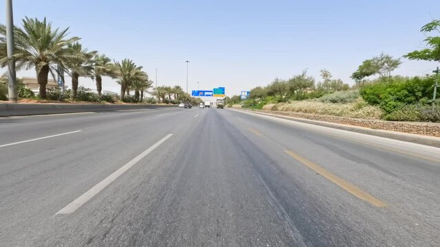 Riyadh: Driving car on road in capital city of Saudi Arabia - landscapes of Arabian Peninsula