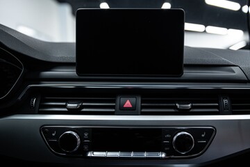  Screen of the multimedia system in a modern car with space for advertising