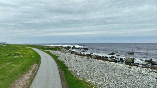 Coastal road near Alnes lighthouse - Following narrow road before flying ahead and ascending above North Sea and Atlantic Ocean