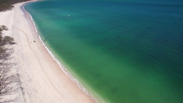 4K Aerial Drone Flight Over Turquoise Blue Clear Ocean Water And White Sand At Conchal Beach, Costa Rica
