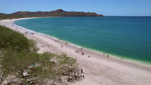 Tropical Scenic Flight Over Popular Tourist Destination, Conchal Beach Costa Rica, 4K Drone Flyover