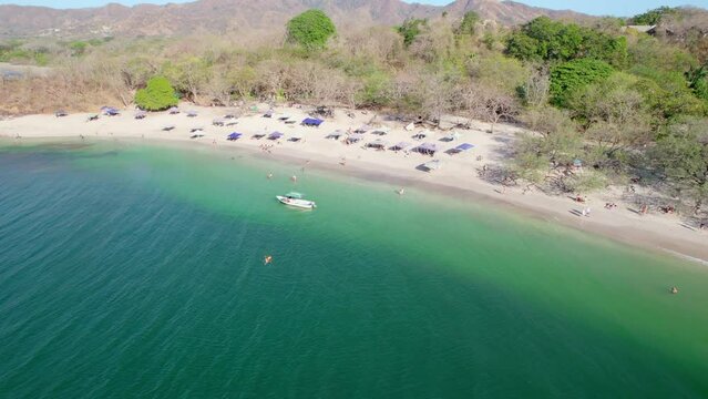 People Boating, Swimming And Enjoying Conchal Beach Costa Rica On Sunny Summer Day, 4K Aerial Drone