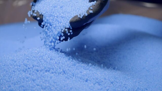 Slow Motion Shot Of Recycled Blue Plastic Grains 