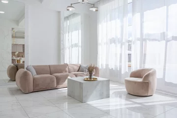 Tapeten living room with soft beige furniture in a light luxury interior design of a modern apartment in a minimalist style with marble trim and huge windows. daylight inside. © 4595886