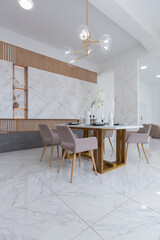 light luxury interior design of a modern apartment in a minimalist style with marble trim and huge windows. daylight inside the kitchen and living room