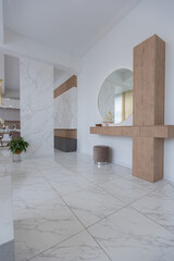 light luxury interior design of a modern apartment in a minimalist style with marble trim and huge windows. daylight inside the kitchen and living room