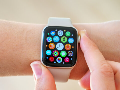 UK - June. 2, 2023: Close up of the apps on the display screen of an Apple Watch worn on woman's wrist
