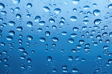 Panoramic banner of water drops on blue metal