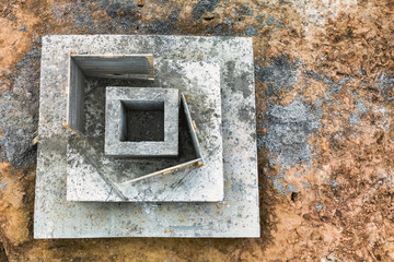 Monolithic reinforced concrete foundations for the construction of a large building. Rostverk at the construction site. Construction pit with foundation. close-up. View from above.
