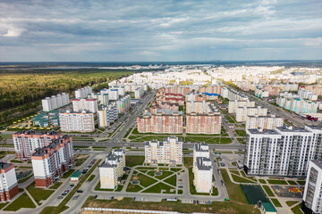 Cityscape of a residential area with modern apartment buildings, new green urban landscape in the...