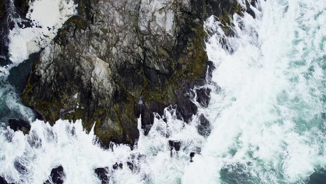 Top down view of the waves breaking on the rocks of Conanicut Island in Narragansett Bay