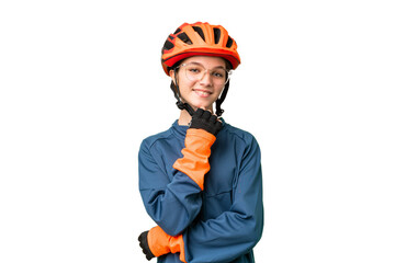 Teenager cyclist girl over isolated chroma key background with glasses and smiling