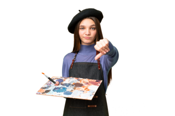 Young artist man holding a palette over isolated chroma key background showing thumb down with negative expression