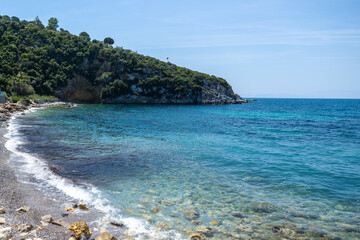 Fototapeta na wymiar Blue bay of the mediterranean sea. Sun, green nature, blue water. Rest, vacation at sea.