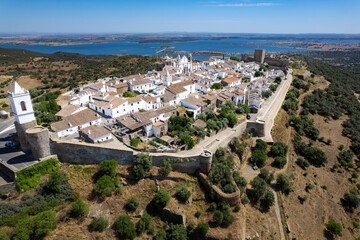 Monsaraz in Alqueva, Alentejo lake Portugal - Aerial view of the beautiful Portuguese village of Monsaraz from above during heat wave in summer