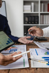Businessmen talk about charts and graphs that show the results of successful teamwork, collaboration, financial accounting concepts. Portrait Picture