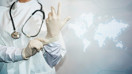 A doctor adjusts his glove. The concept of world diseases