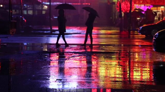 Cinemagraph of two women on a road staying still. Reflections move