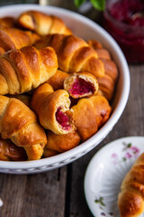 Homemade crescents with edible rose jam. Traditional Ukrainian baked goods.