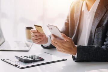 Businesswoman hands holding cradit card and using credit card online shopping. Online shopping concept