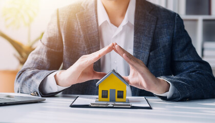 Real estate agent and customer signing contract to buy house, insurance or loan real estate.rent a house,get insurance or loan real estate or property.