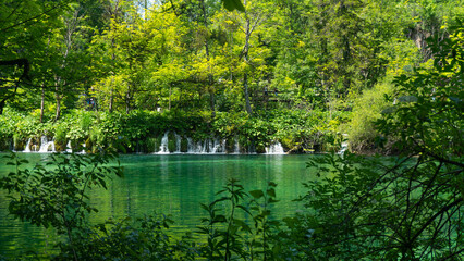 Beautiful waterfall with blue lake in Plitvice Lakes National Park, Croatia