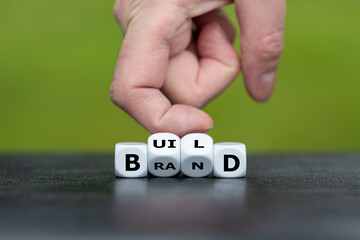 Dice form the words 'build' and 'brand'.
