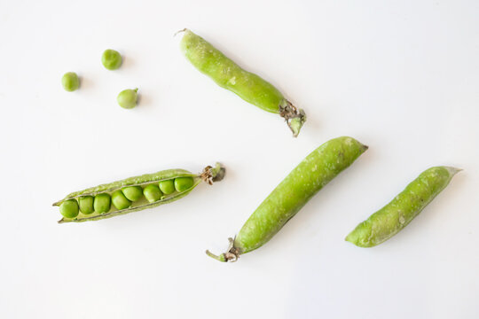 Sweet green peas. View from above. White background.