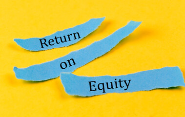 RETURN ON EQUITY text on a blue pieces of paper on yellow background, business concept