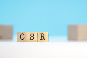 letters csr written in cubes.
corporate social responsibility green climate or eco-friendly green business concept