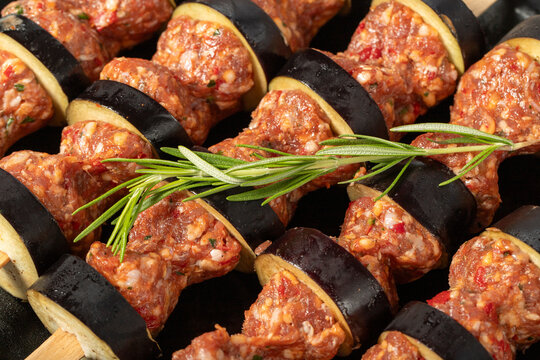 Eggplant kebab. Close-up of aubergine shish kebab with raw minced meat. Food background.Turkish cuisine delicacies. Local name patlican kebabi