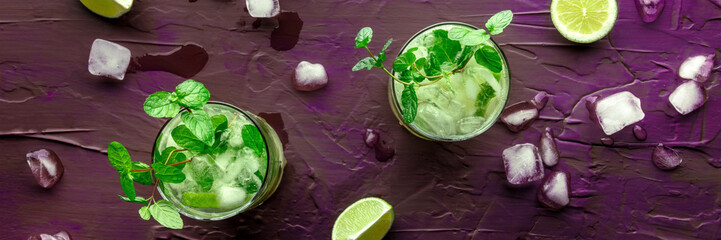Mojito cocktail. Summer cold drink with lime, fresh mint, and ice. Cool beverage