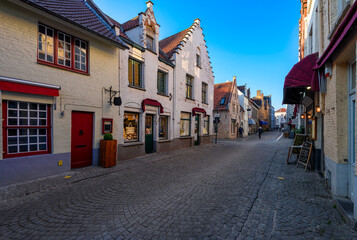 Fototapeta na wymiar Old cozy street in Bruges (Brugge), Belgium. Cityscape of Bruges. Typical architecture of Bruges