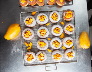 Brioche doughnut mango flavour freshly baked and sugar coated with custard filling.